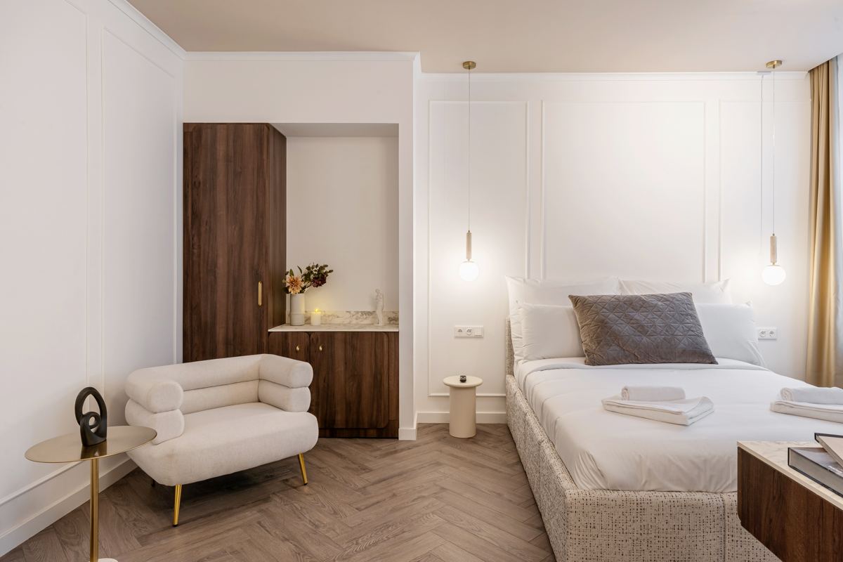 Superior Room with armchair, wardrobe niche and double bed